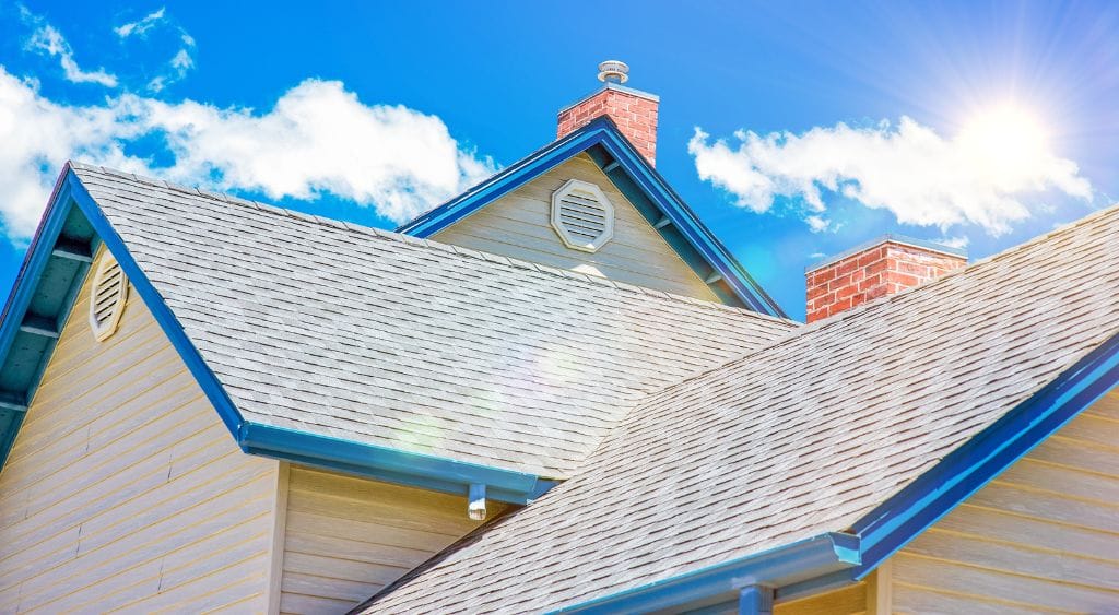 Arlington roof with reflective roof coating under bright sunlight, reducing energy costs and protecting from weather extremes.