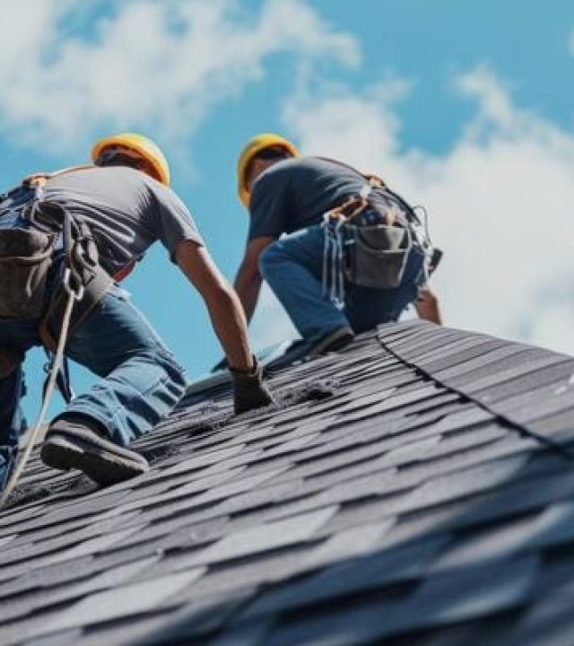 Roofer performing roof repairs on a home in Austin, TX