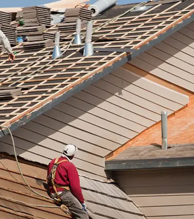 Roofer installing a new roof on a home in Austin, TX