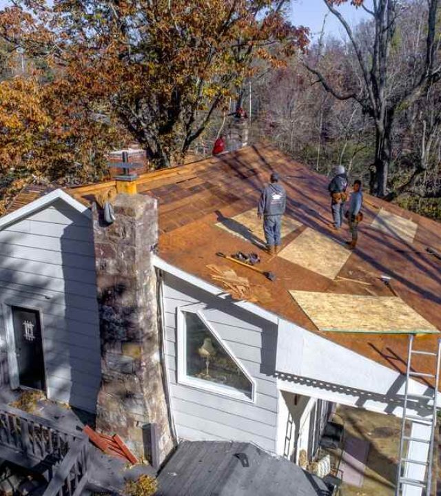 Roofer installing a new roof on a home in Austin, TX