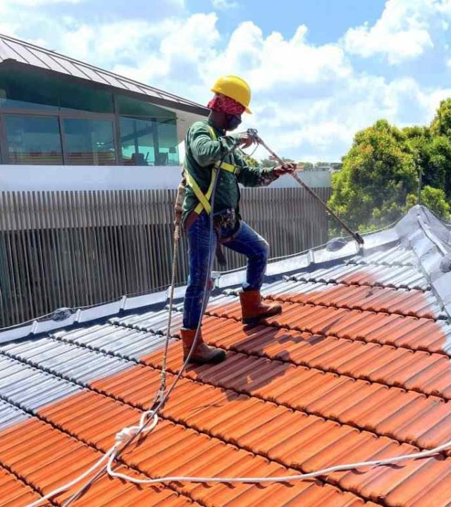 Waterproofing team applying protective coating on a building in Austin, TX