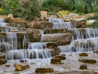 beautiful-tranquil-waterfall-cascade-flows-over-natural-stone-steps-peaceful-oasis-beautifully-serene-gracefully-stacked-340300722