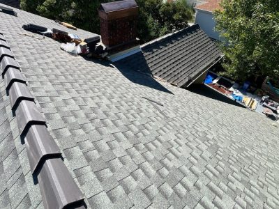 Commercial roofing team working on a large building in Austin, TX