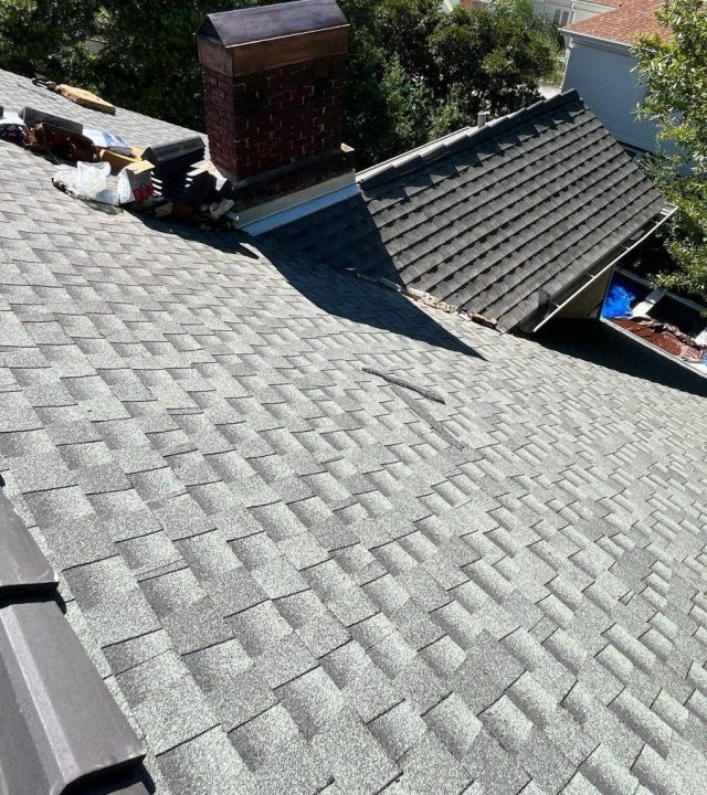 Commercial roofing team working on a large building in Austin, TX