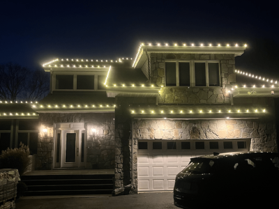 Festive holiday light installation on a home in Austin, TX