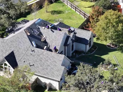 Trusted residential roofing team working on a home in Austin, TX